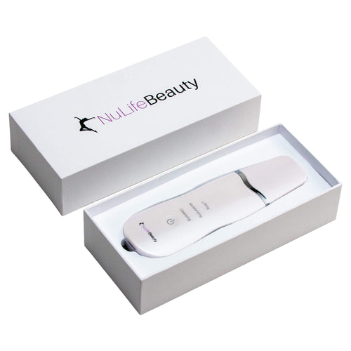 NuLifeBeauty Ultrasonic Face Scrubber in white, lying in its open NuLifeBeauty box